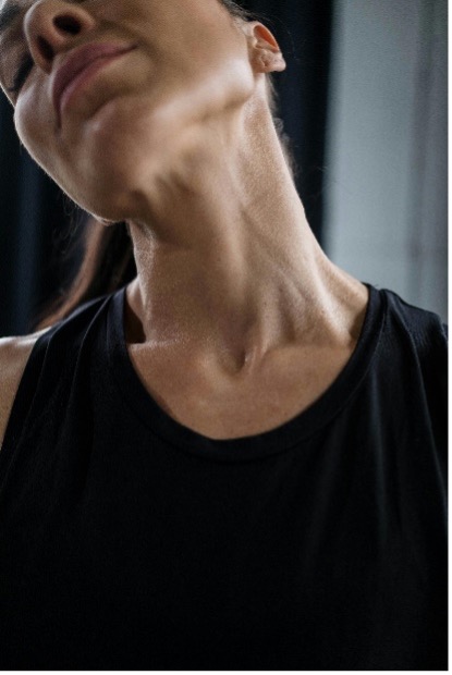 Close up of a person stretching their neck